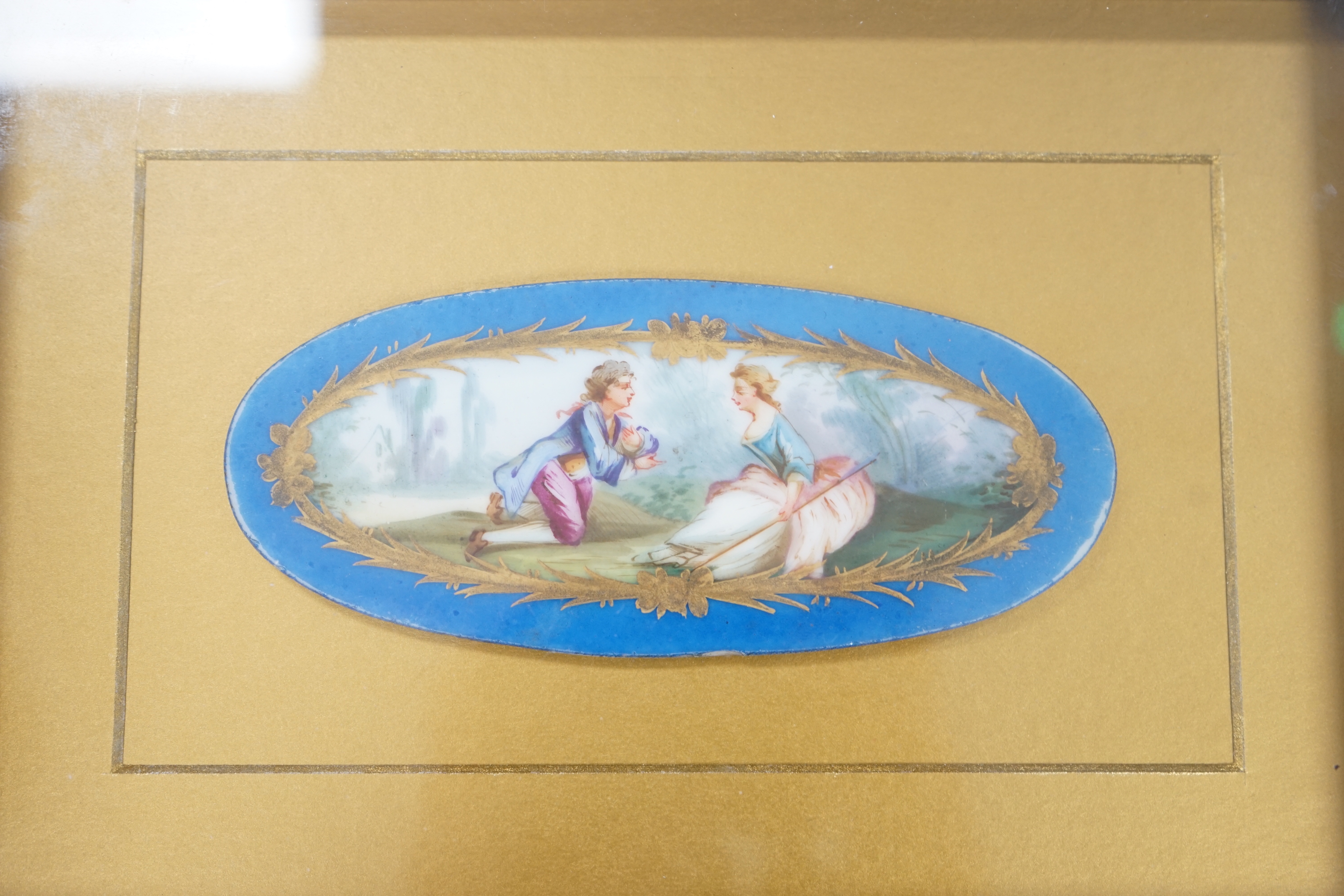 A pair of framed Sevres style porcelain oval plaques and a papier mache panel, inscribed verso and dated 1797, pair 26cm x 18cm